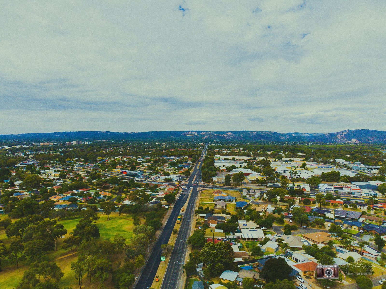 an aerial view of a city with lots of trees